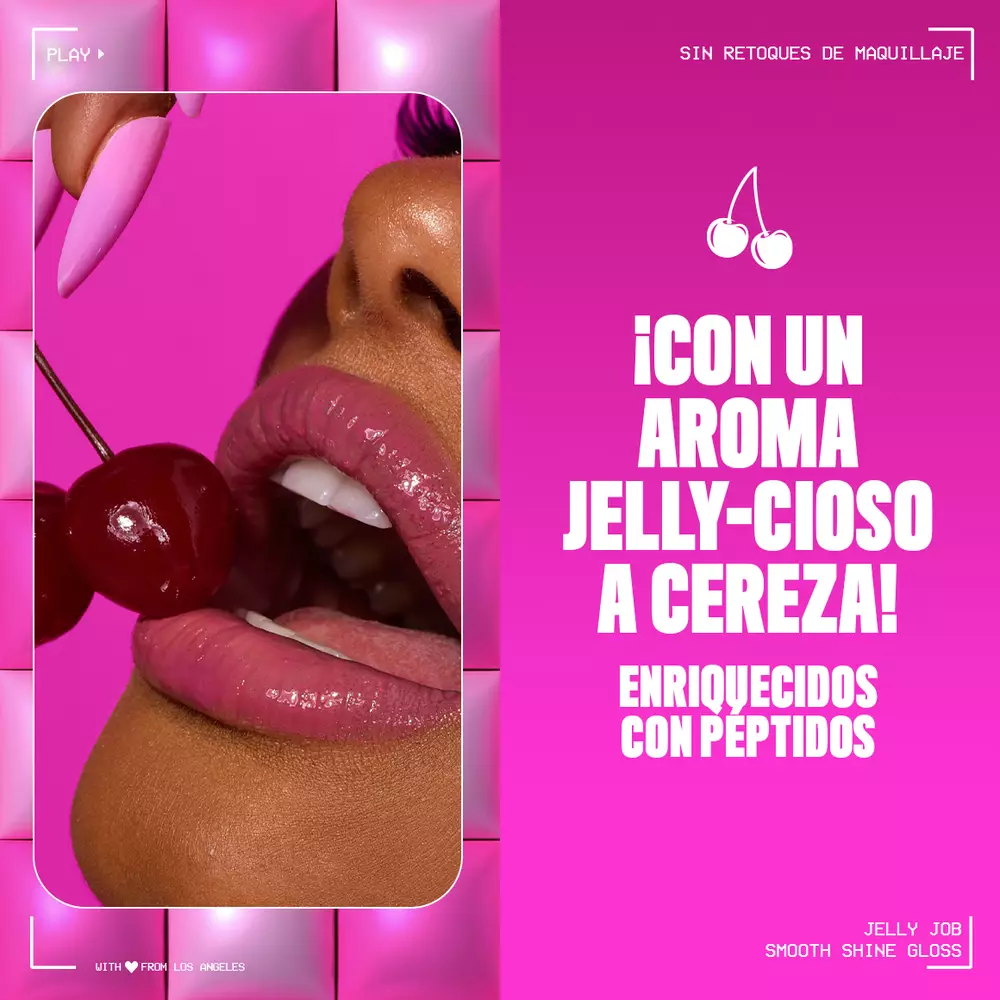 A vibrant ad for 'Jelly Job Smooth Shine Gloss' features a close-up of a person with glossy pink lips holding two cherries, set against a hot pink, padded background. Text highlights 'NO MAKEUP RETOUCHING' and 'JIGGLIN' IN A JUICY CHERRY SCENT!'