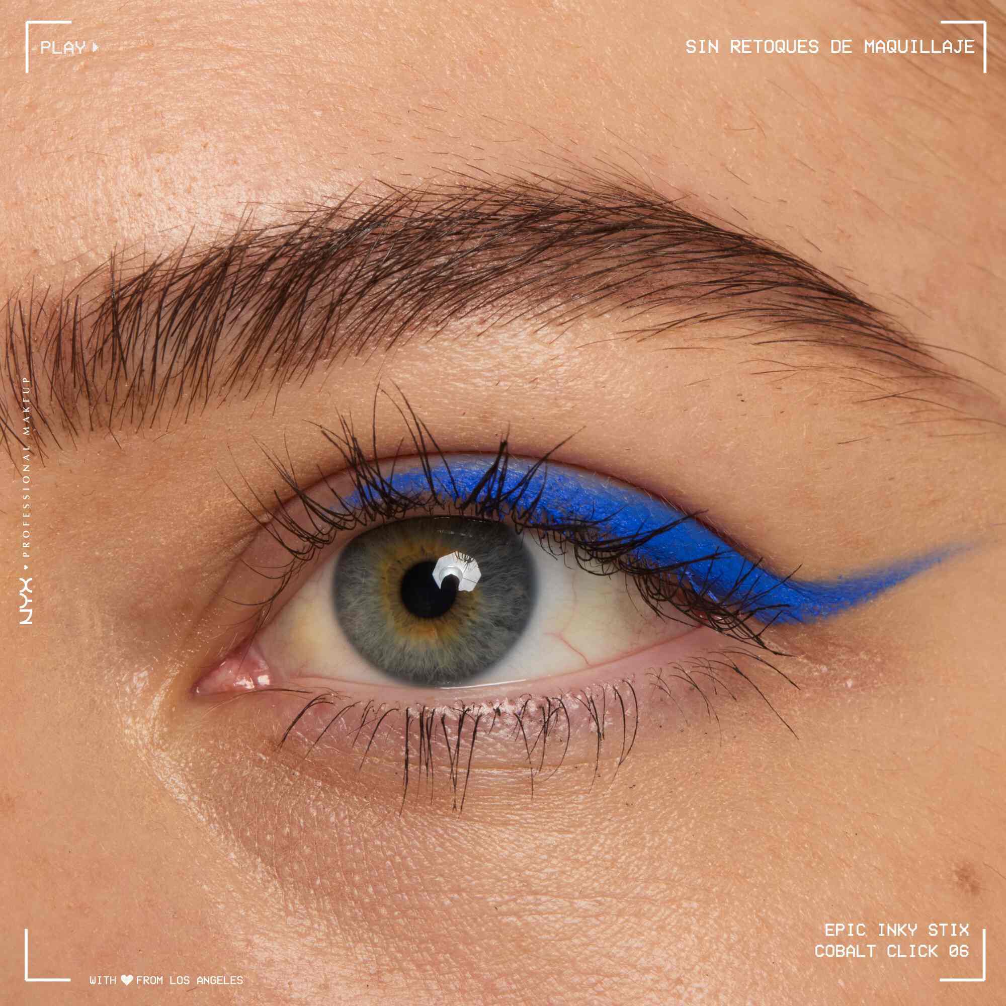 Close of a model wearing Epic Inky Stix on the top of their eyelid as a winged liner style in shade 05 Cobalt Click