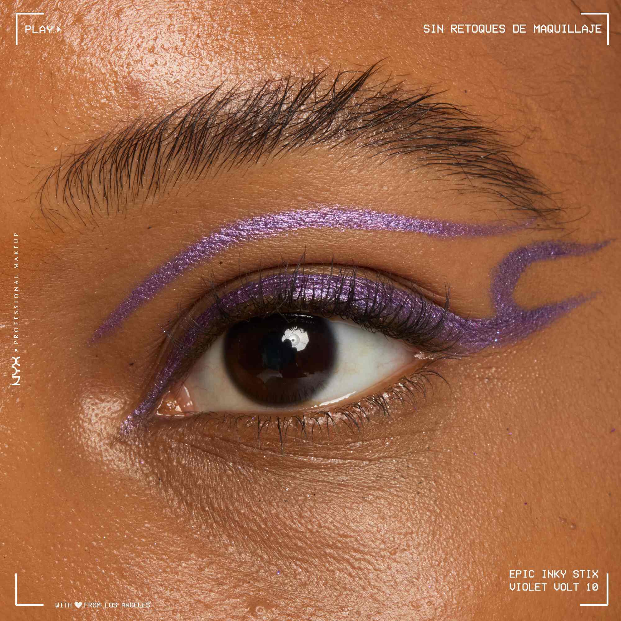 Close of a model wearing Epic Inky Stix on the top of their eyelid as a winged liner style in shade 09 Violet Volt
